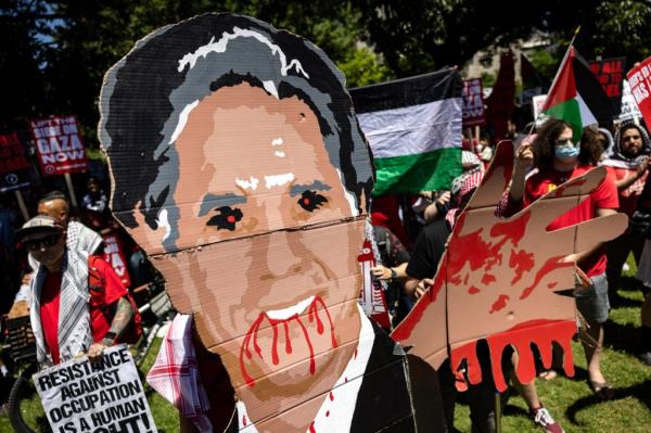 Pro-Palestinian activists hold up a effigy of U.S. Secretary of State Antony Bl<em></em>inken during a demo<em></em>nstration in Lafayette Park in front of the White House to protest the war in Gaza on June 8, 2024 in Washington, DC.