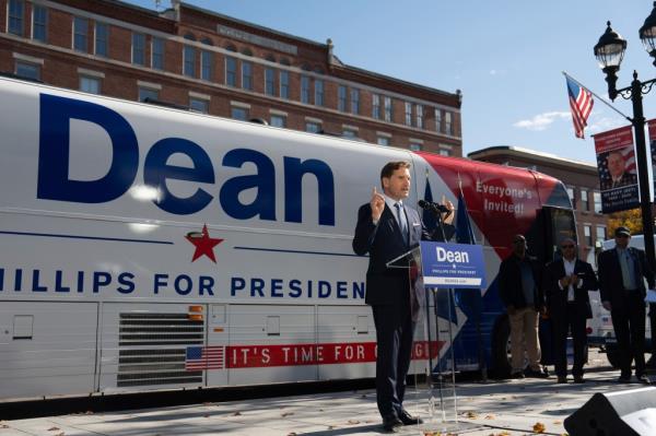 After signing a declaration of candidacy to run for president and walking out of the New Hampshire Statehouse, Democratic Rep. Dean Phillips addresses the crowd, Friday, Oct. 27, 2023, in Concord, Minn. Phillips, who is challenging Joe Biden in the primary, announced Friday, Nov. 24, he will not seek reelection to Co<em></em>ngress in 2024. (Glen Stubbe/Star Tribune via AP, File)