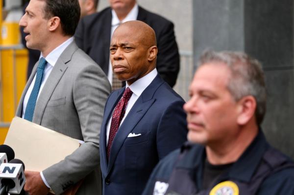 NYC Mayor Eric Adams leaving Federal Court, dressed in a suit, after pleading 'Not Guilty' to numerous charges